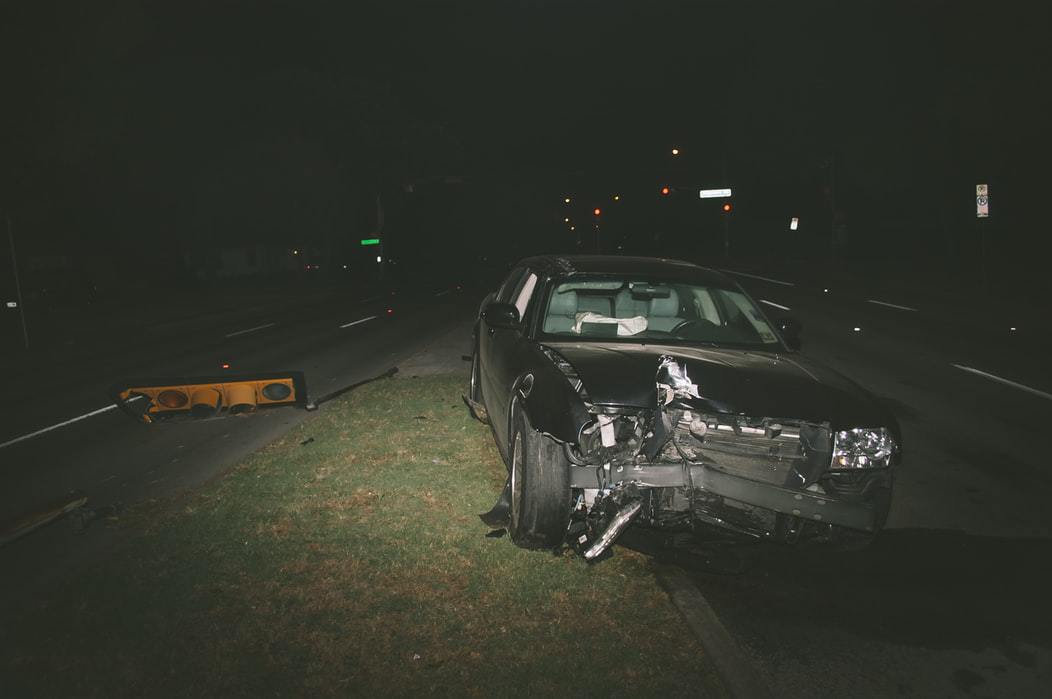 Car Wreck Near Broekn Streetlight At Night