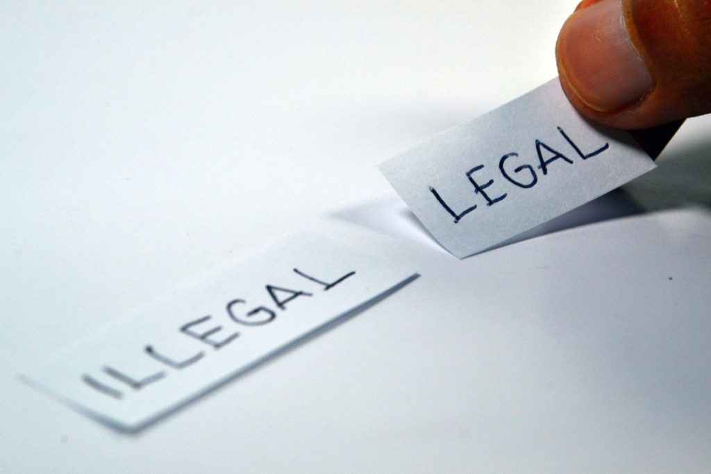 word s legal and illegal on a piece of paper