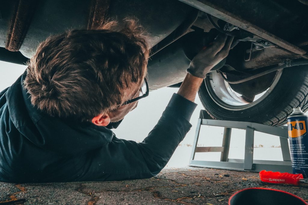 mechanic making repairs after recommendation from a car accident lawyer